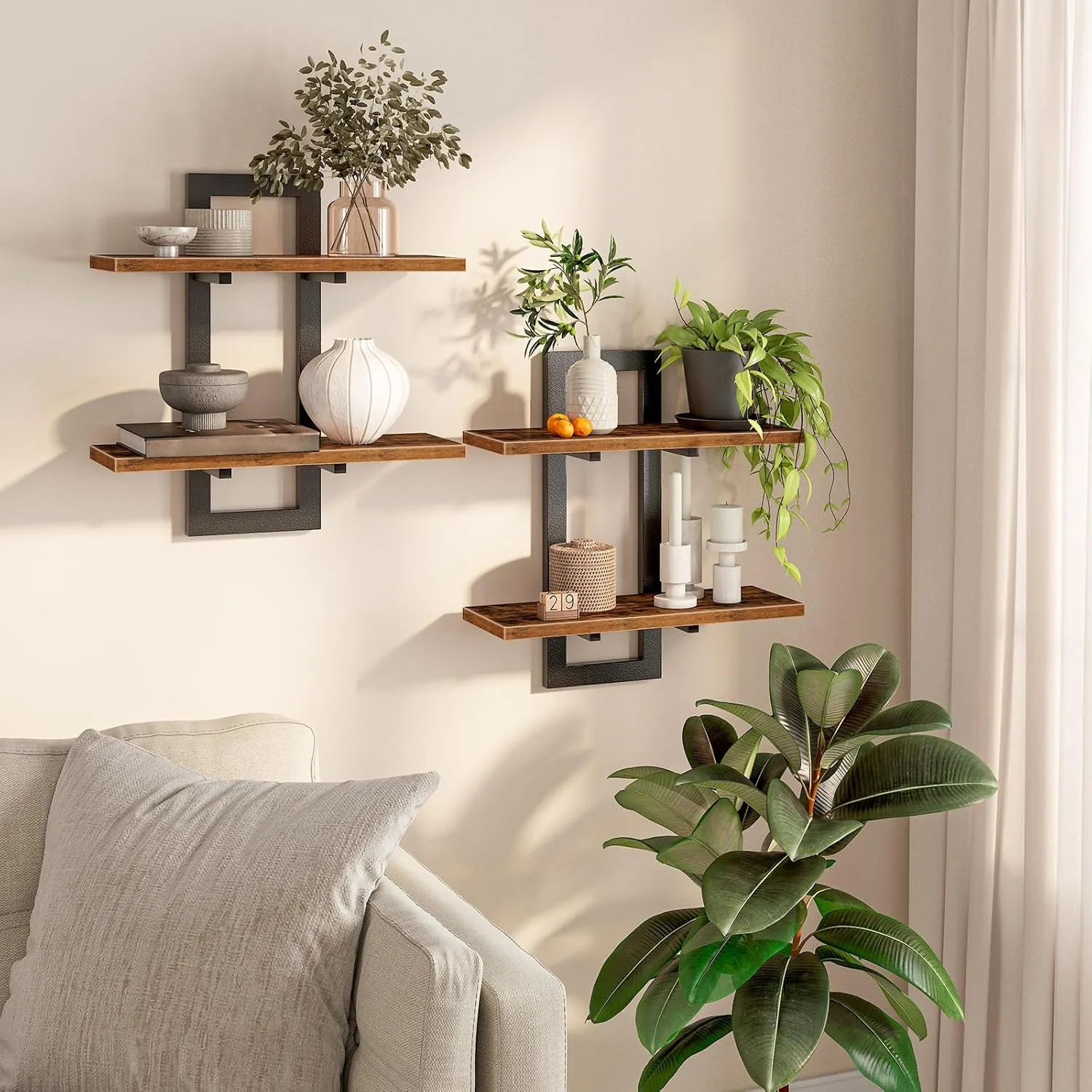 Rustic wood and black metal floating wall shelves styled with trailing plants, ceramic vases, and books above a neutral sofa in bright natural light.